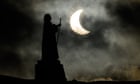 Partial solar eclipse: moon blocks part of sun for people in northern hemisphere – as it happened