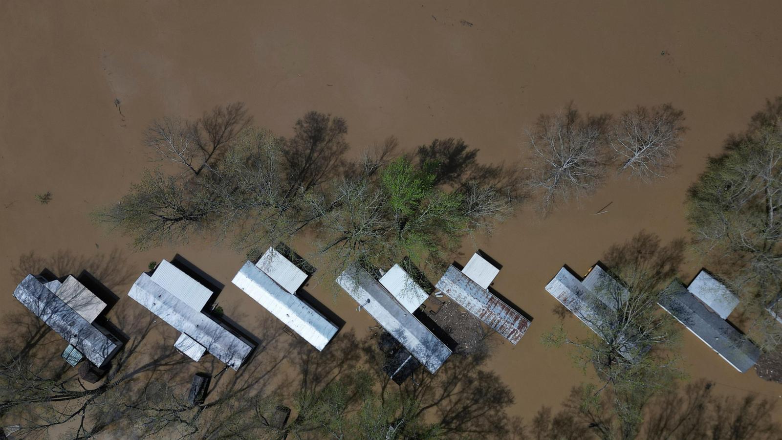 Kentucky watches for surging rivers to recede so widespread cleanup can begin