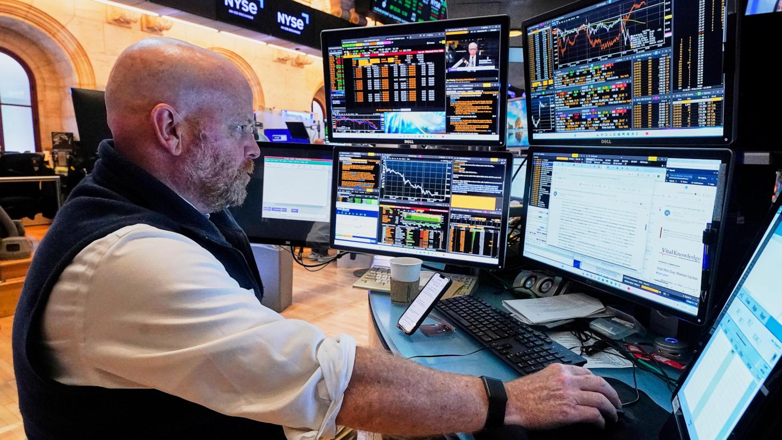 Wall Street tiptoes around its records as its busy week picks up momentum