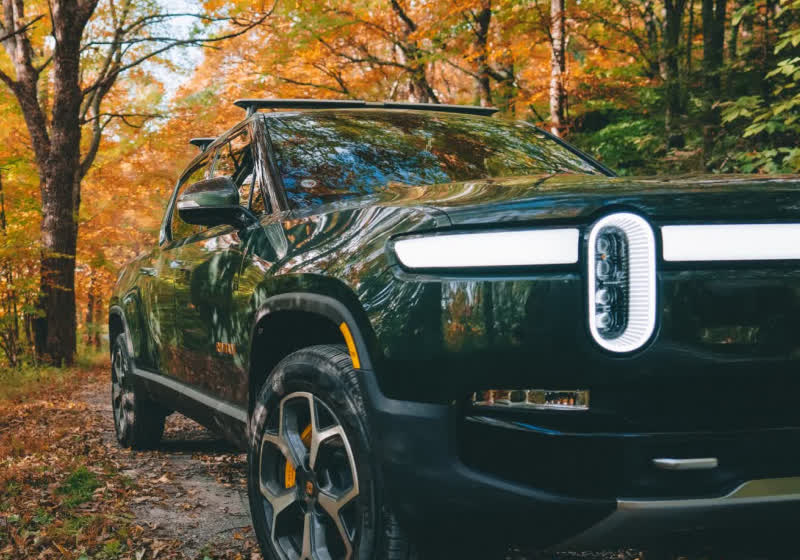 Rivian expands hands-free driving system, builds proprietary AI chip