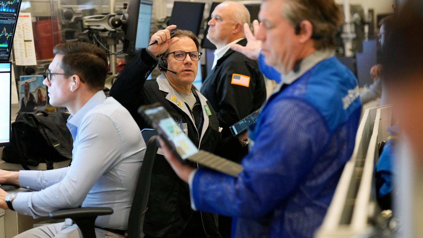 World shares are mostly lower in quiet holiday trading as China stages war drills near Taiwan