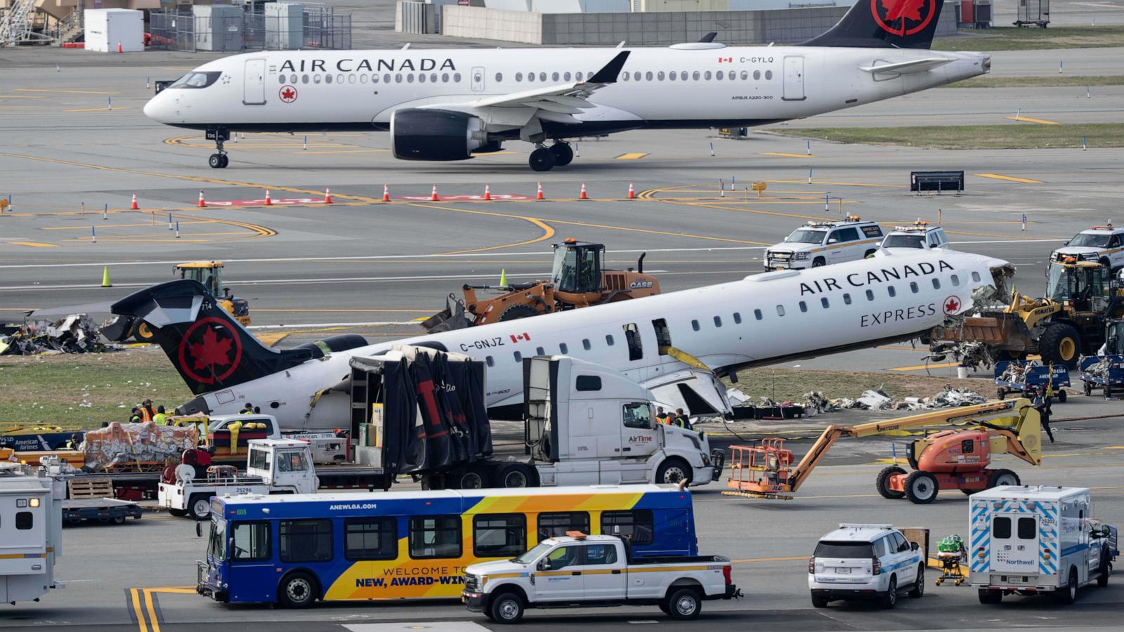 Mangled plane in LaGuardia crash is towed from runway as most injured passengers leave hospital