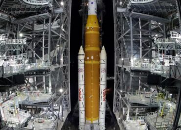 NASA hauls repaired moon rocket from hangar back to the pad for an early April launch